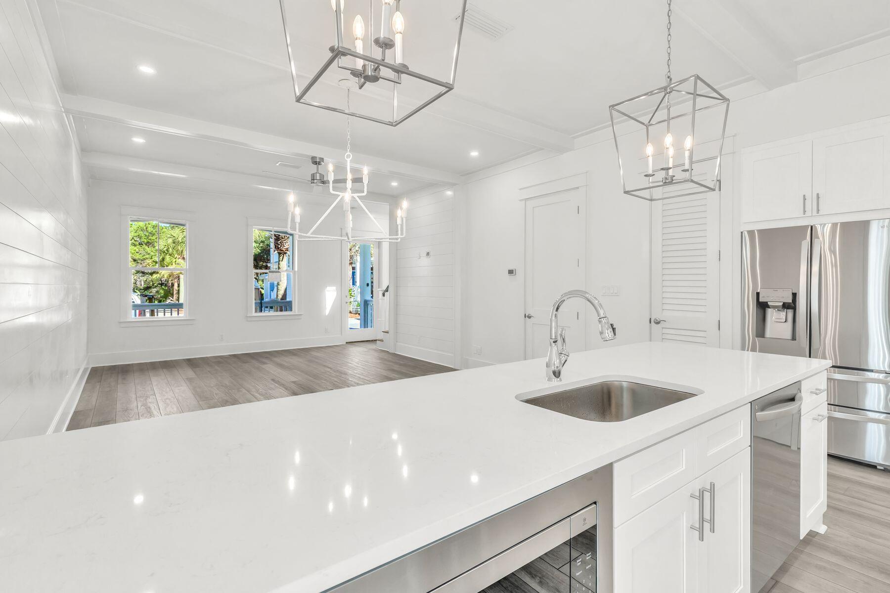 163 Beach Bike Way Inlet Beach Inlet Beach, FL 32461 - Photo 4 of 32 a view of a kitchen with a sink and chandelier