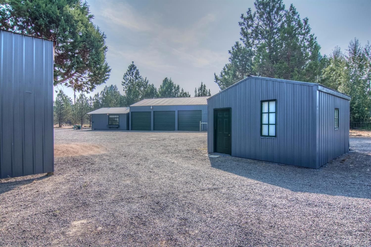 18762 Ridgecrest Road Bend, OR 97703 - Photo 23 of 25 a house with trees in front of it