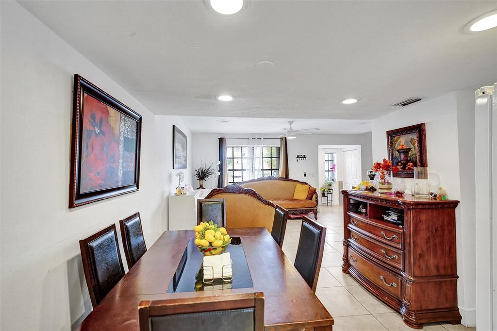 1732 West 72nd Street, Unit 1732 Hialeah, FL 33014 - Photo 13 of 58 a view of a dining room with furniture a rug and wooden floor