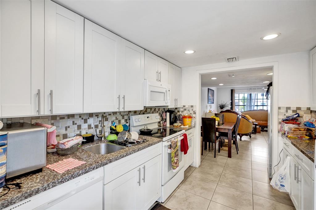 1732 West 72nd Street, Unit 1732 Hialeah, FL 33014 - Photo 15 of 58 a hallway with view of living room