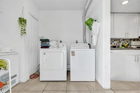 a bathroom with a granite countertop sink mirror vanity and toilet