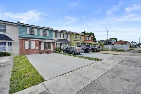 a city street lined with buildings and cars