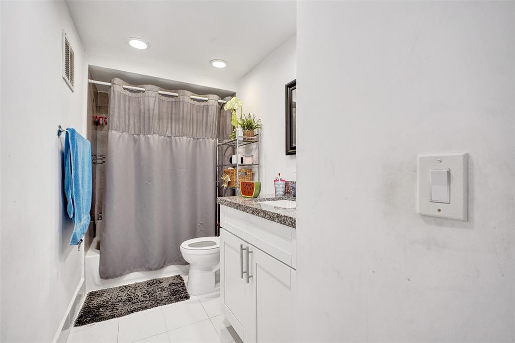 1732 West 72nd Street, Unit 1732 Hialeah, FL 33014 - Photo 29 of 58 a bathroom with a sink toilet and shower
