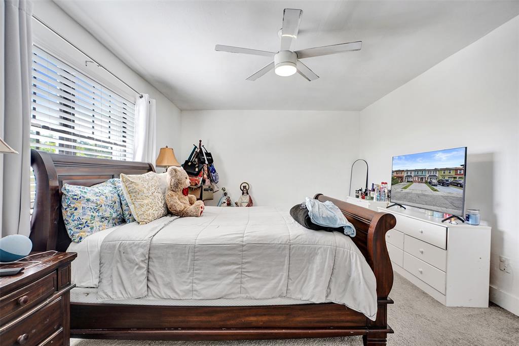 1732 West 72nd Street, Unit 1732 Hialeah, FL 33014 - Photo 32 of 58 a bedroom with a bed and window