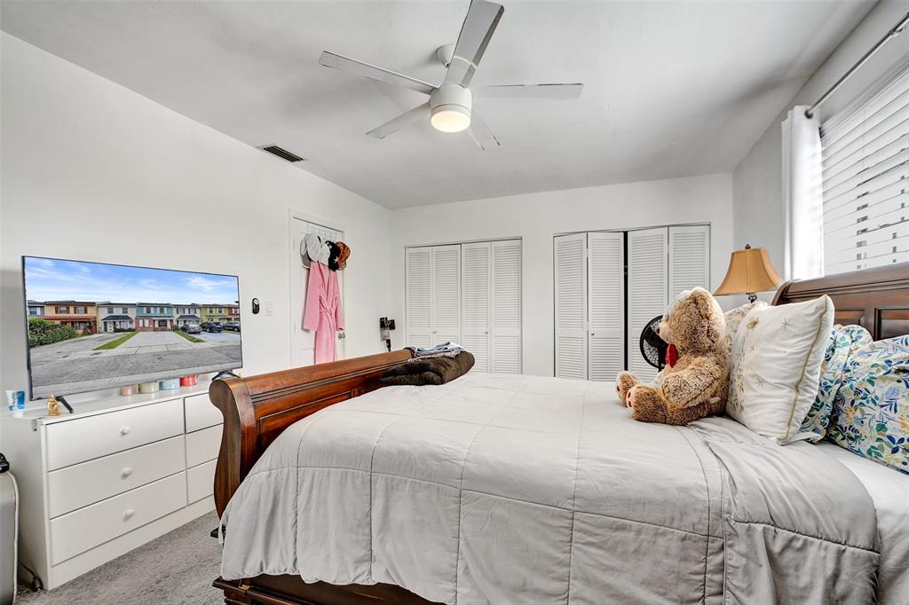 1732 West 72nd Street, Unit 1732 Hialeah, FL 33014 - Photo 34 of 58 a bedroom with a bed and a large window