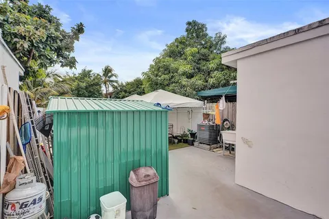 a view of a backyard with chairs