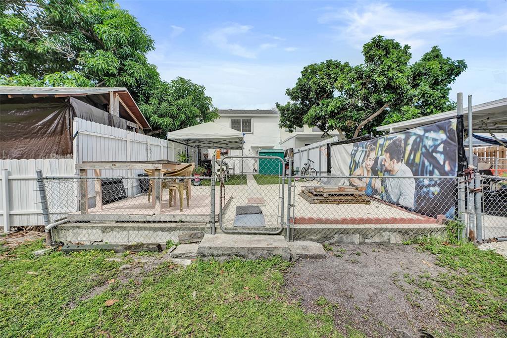 1732 West 72nd Street, Unit 1732 Hialeah, FL 33014 - Photo 51 of 58 a view of a house with backyard and sitting area