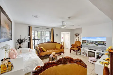 a workspace with furniture and a flat screen tv