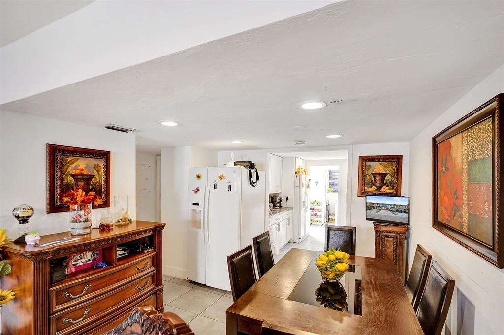 1732 West 72nd Street, Unit 1732 Hialeah, FL 33014 - Photo 9 of 58 a living room with furniture and a flat screen tv