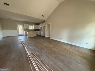 4381 Nessmith Road Statesboro, GA 30458 - Photo 2 of 11 a view of a livingroom with wooden floor