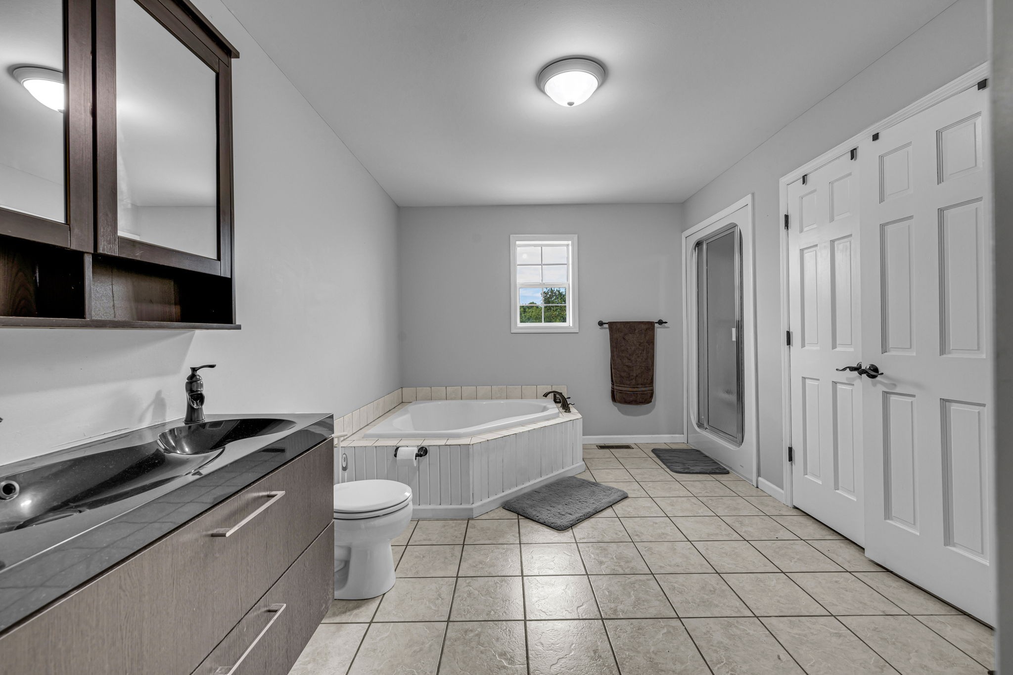 2188 Hicks Lane Columbia, TN 38401 - Photo 23 of 61 a bathroom with a sink a toilet a mirror and shower
