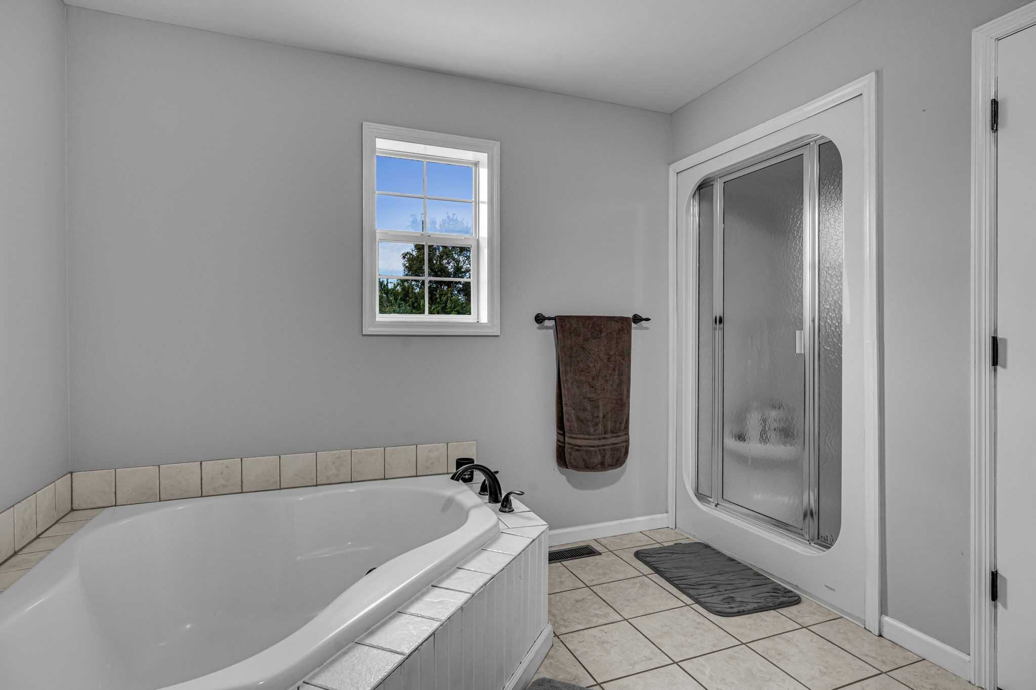 2188 Hicks Lane Columbia, TN 38401 - Photo 25 of 61 a bathroom with a tub a toilet and a shower