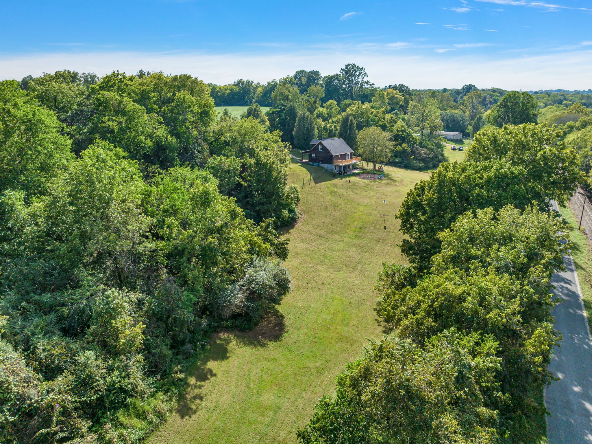 2188 Hicks Lane Columbia, TN 38401 - Photo 48 of 61 an aerial view of residential houses with outdoor space and trees all around