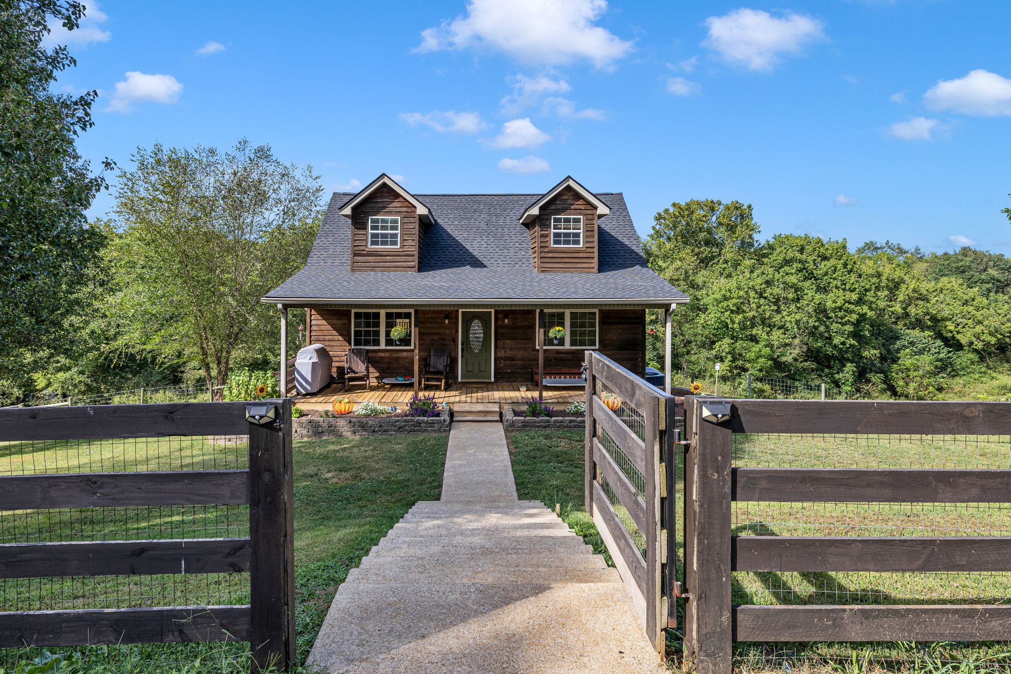 2188 Hicks Lane Columbia, TN 38401 - Photo 5 of 61 a front view of a house with yard porch and furniture