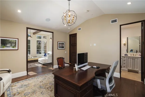 a view of a workspace with furniture