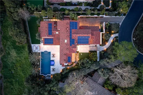 an aerial view of a house with a garden