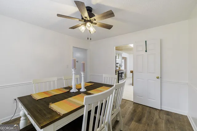 a kitchen with stainless steel appliances granite countertop a sink and a stove