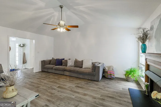 a living room with furniture and a fireplace