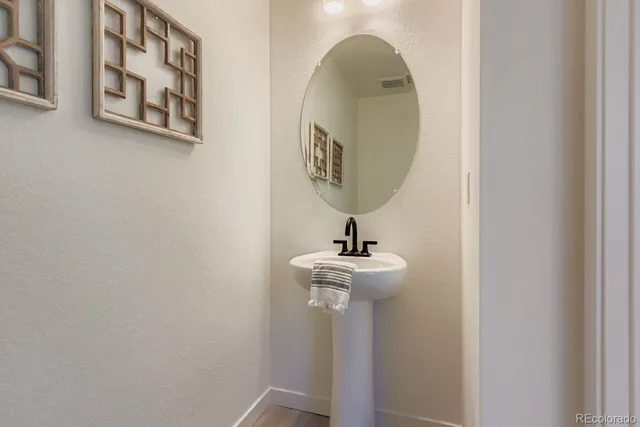a front view of a bathroom with a sink