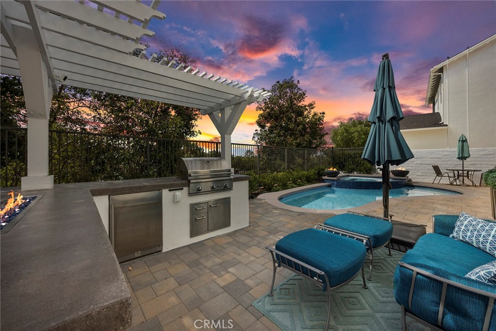 16 Kempton Lane Ladera Ranch, CA 92694 - Photo 55 of 60 Evening view rear yard (digitally enhanced fire).