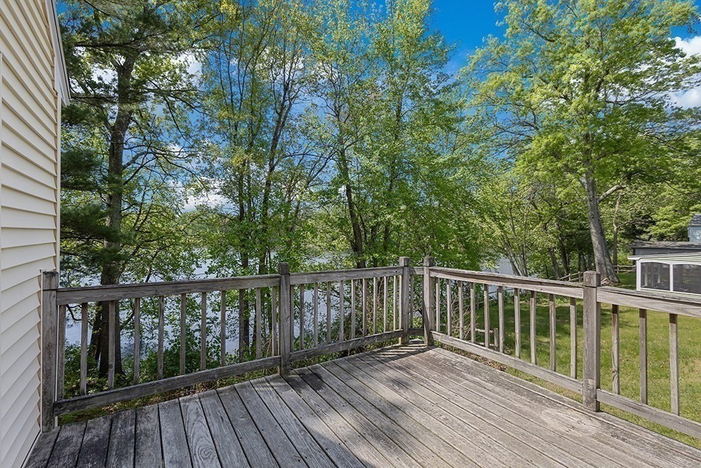 117 Oak Ridge Drive Ayer, MA 01432 - Photo 22 of 26 a view of balcony with wooden floor and fence
