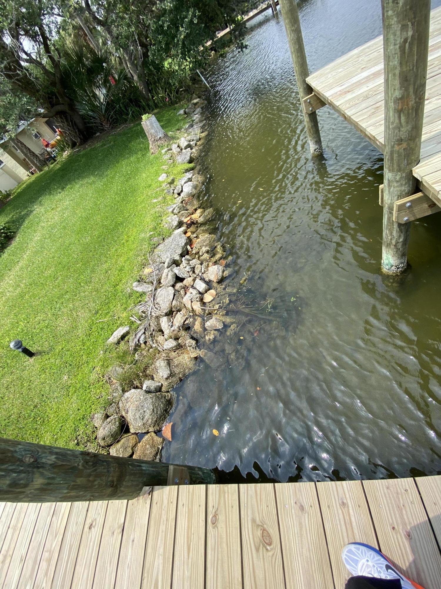 367 Capri Road Cocoa Beach, FL 32931 - Photo 14 of 27 a view of yard from a balcony