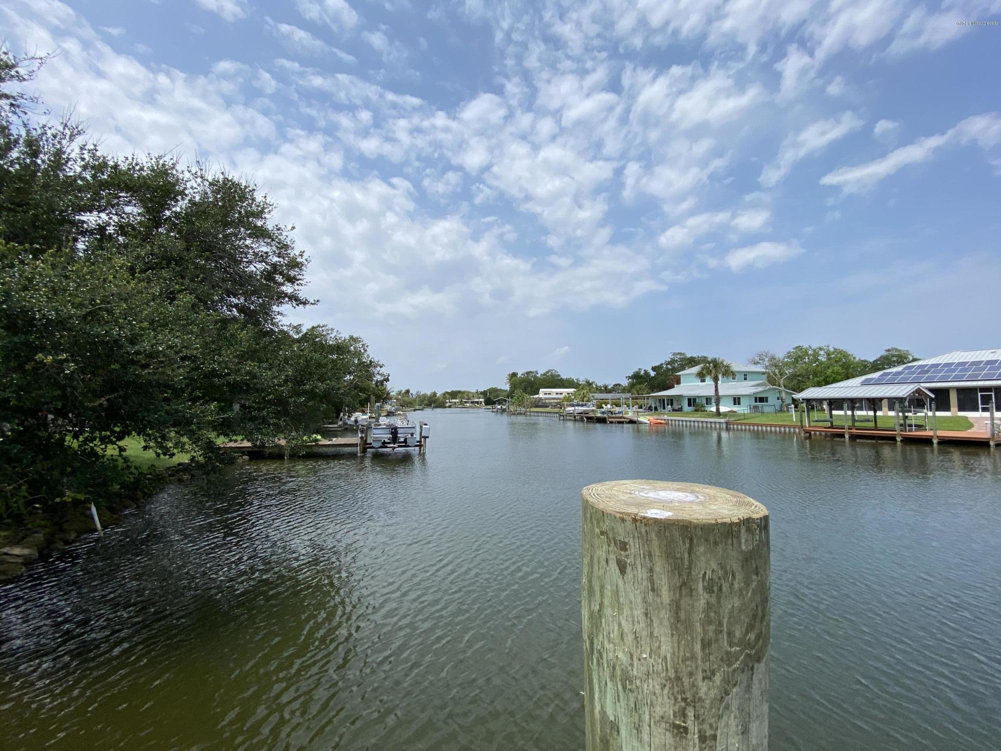 367 Capri Road Cocoa Beach, FL 32931 - Photo 15 of 27 a view of a lake with houses in outdoor space