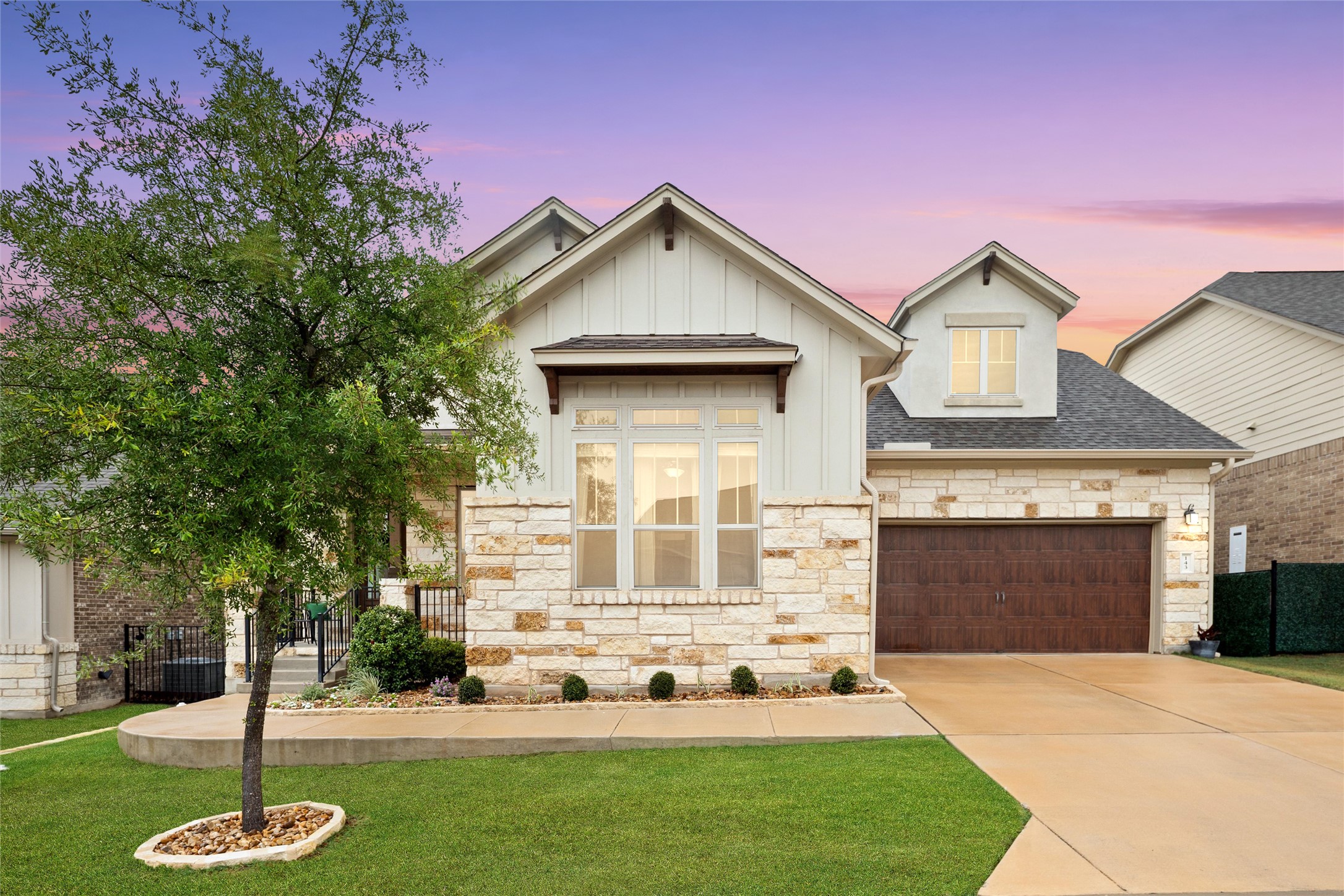 143 Bright Vly Way Austin, TX 78737 - Photo 1 of 34 a front view of a house with a yard