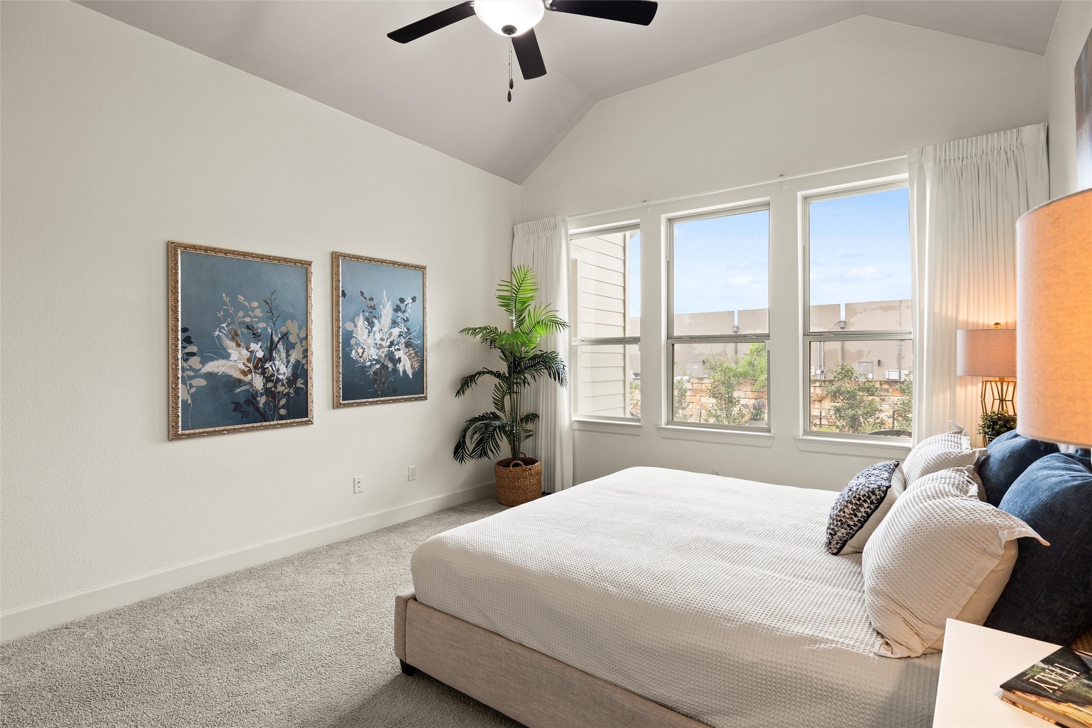 143 Bright Vly Way Austin, TX 78737 - Photo 21 of 34 a bedroom with a large bed and a painting on the wall
