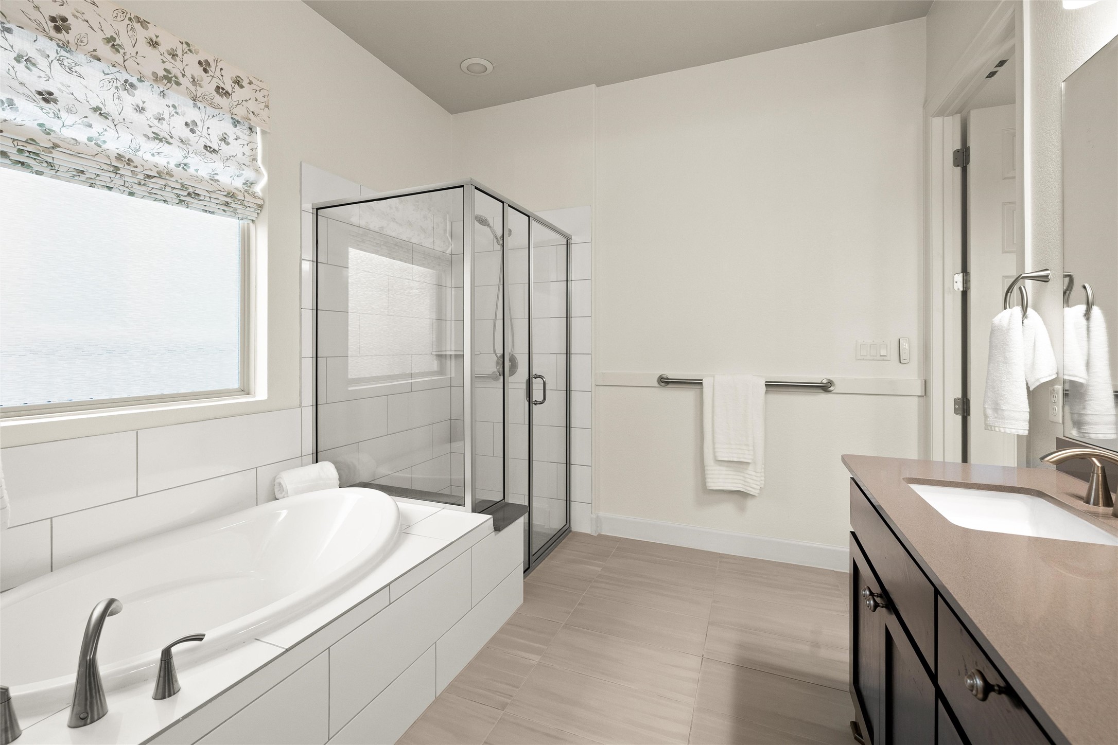 143 Bright Vly Way Austin, TX 78737 - Photo 23 of 34 a spacious bathroom with a tub sink and mirror