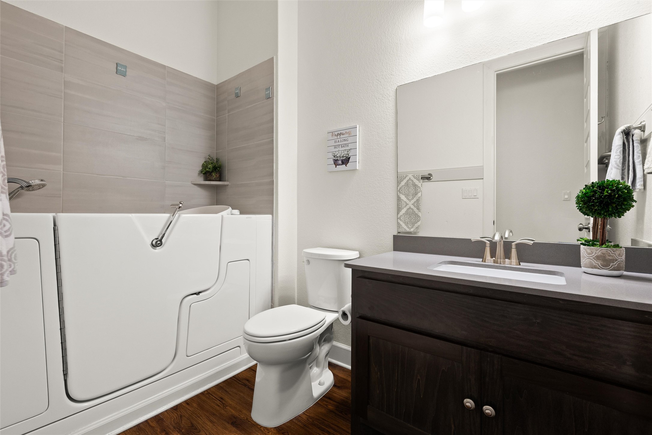 143 Bright Vly Way Austin, TX 78737 - Photo 27 of 34 a bathroom with a granite countertop toilet sink and mirror