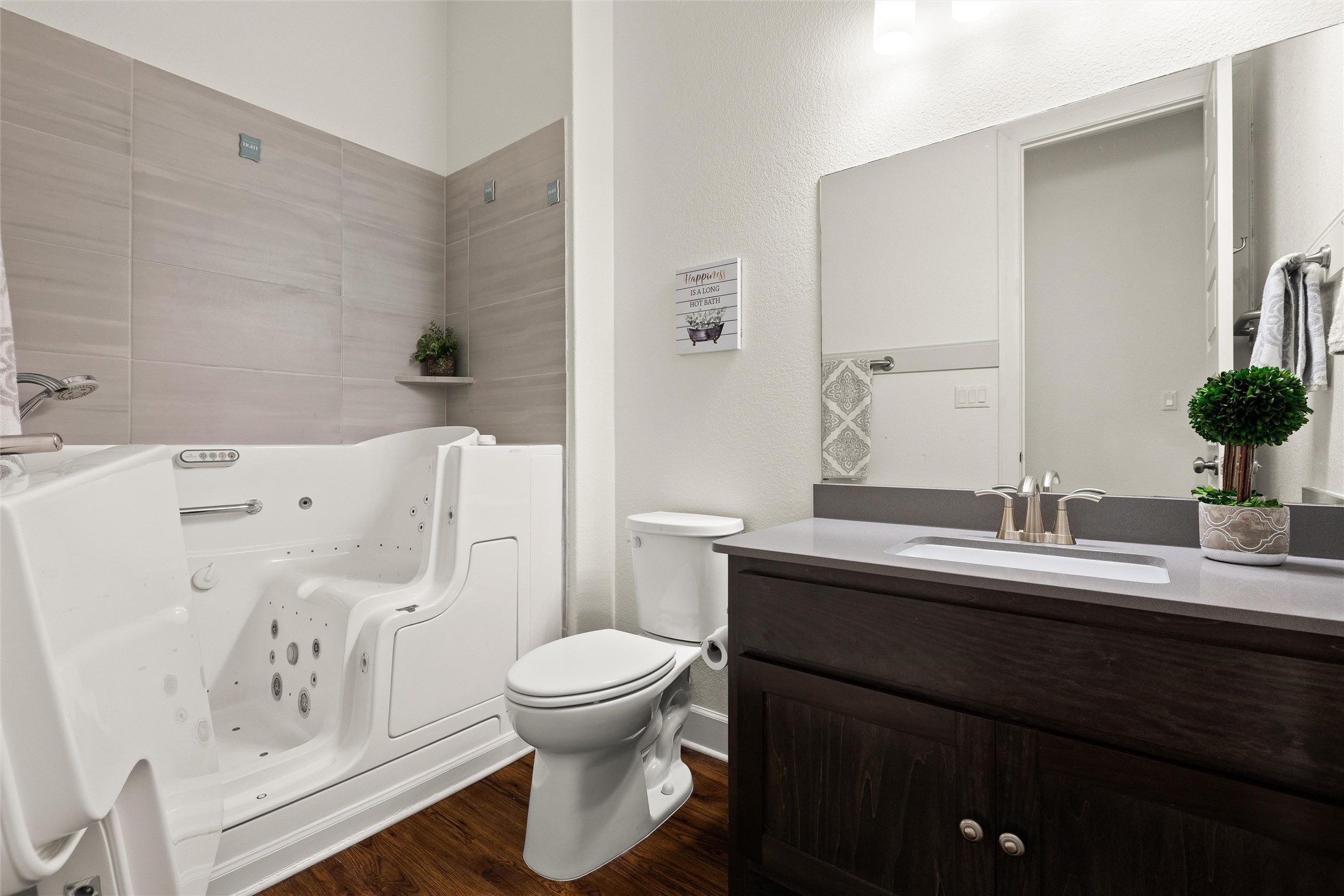 143 Bright Vly Way Austin, TX 78737 - Photo 28 of 34 a bathroom with a granite countertop toilet sink and mirror