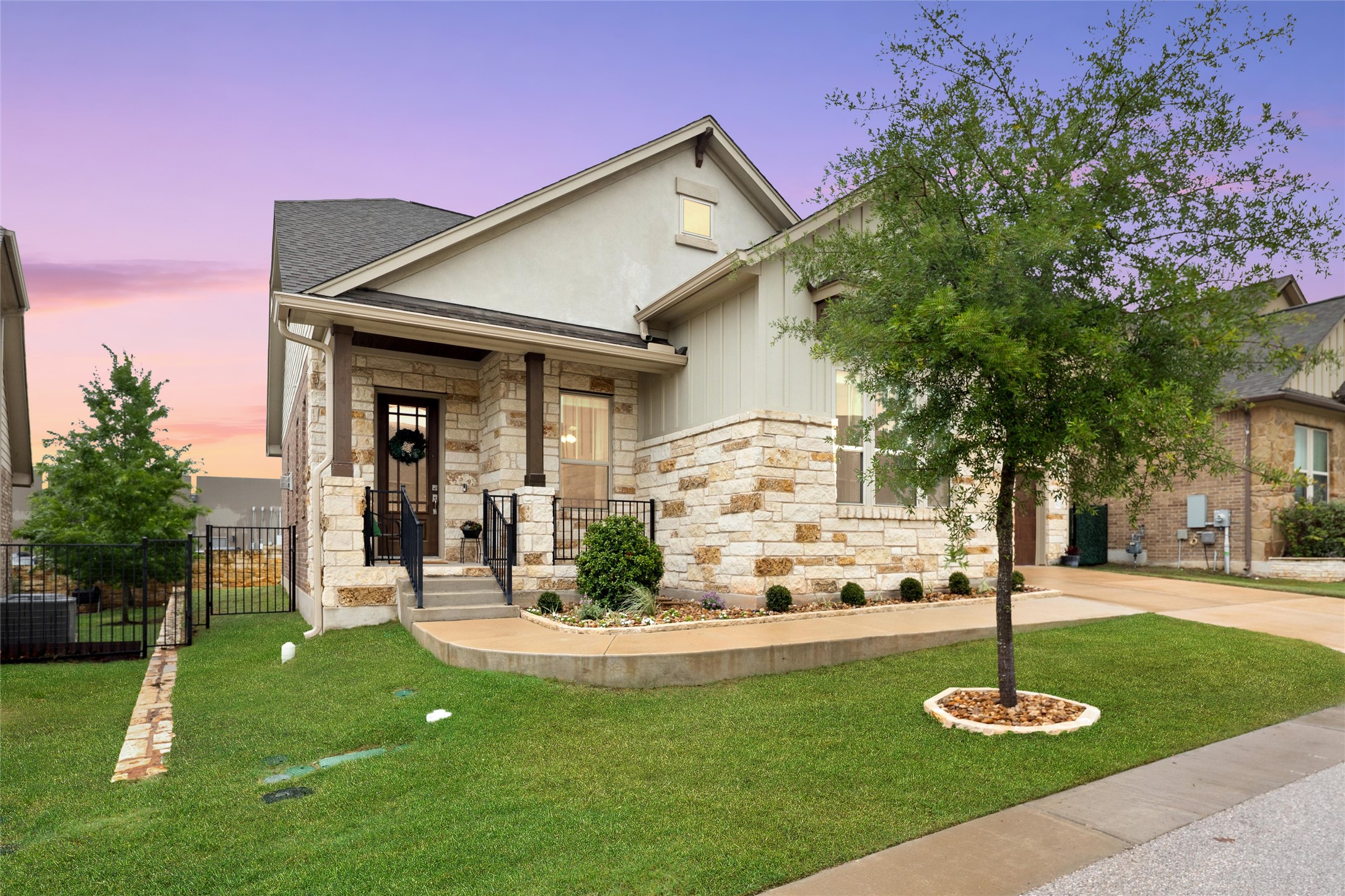 143 Bright Vly Way Austin, TX 78737 - Photo 3 of 34 a front view of a house with a yard