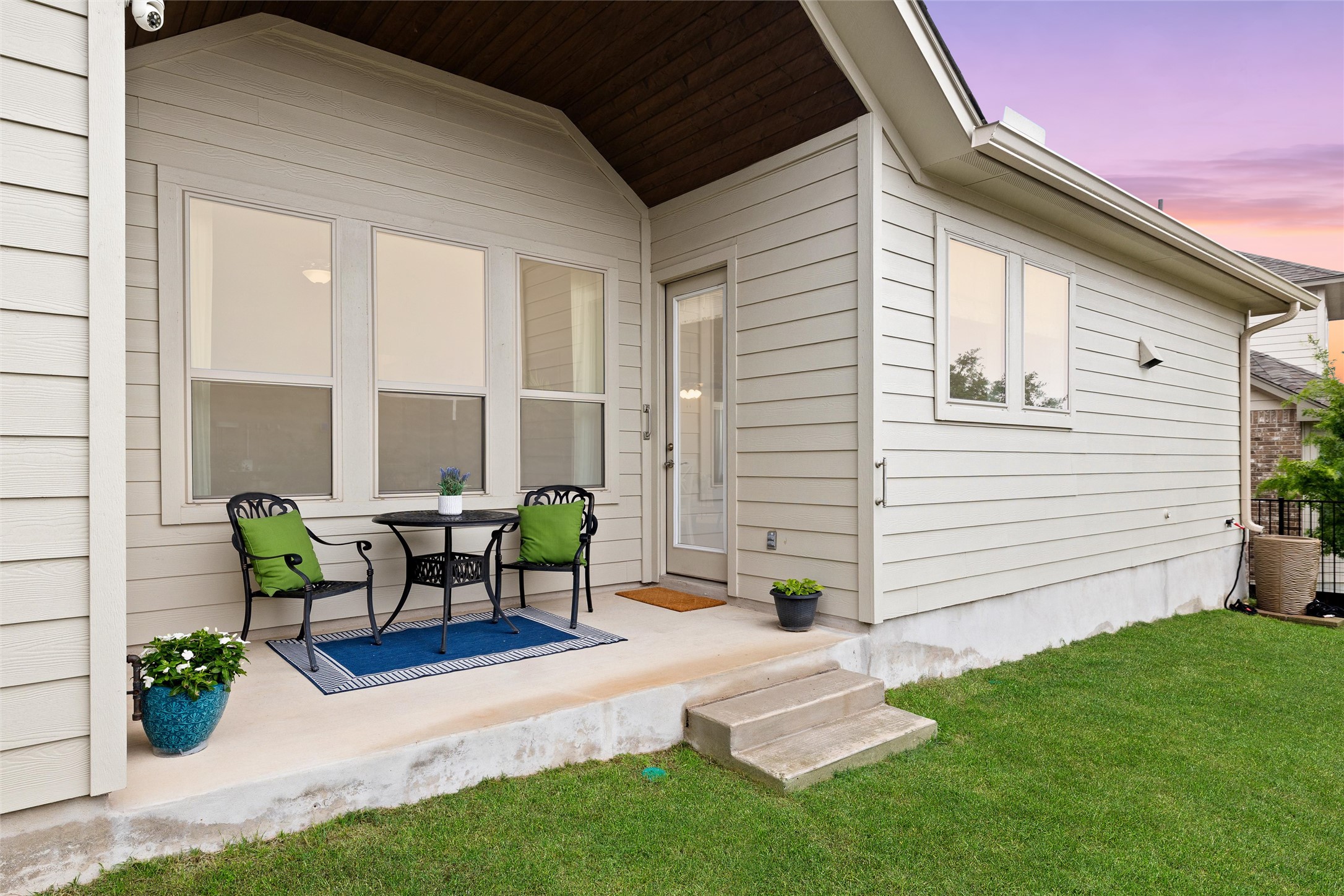 143 Bright Vly Way Austin, TX 78737 - Photo 31 of 34 a view of a patio with table and chairs and potted plants