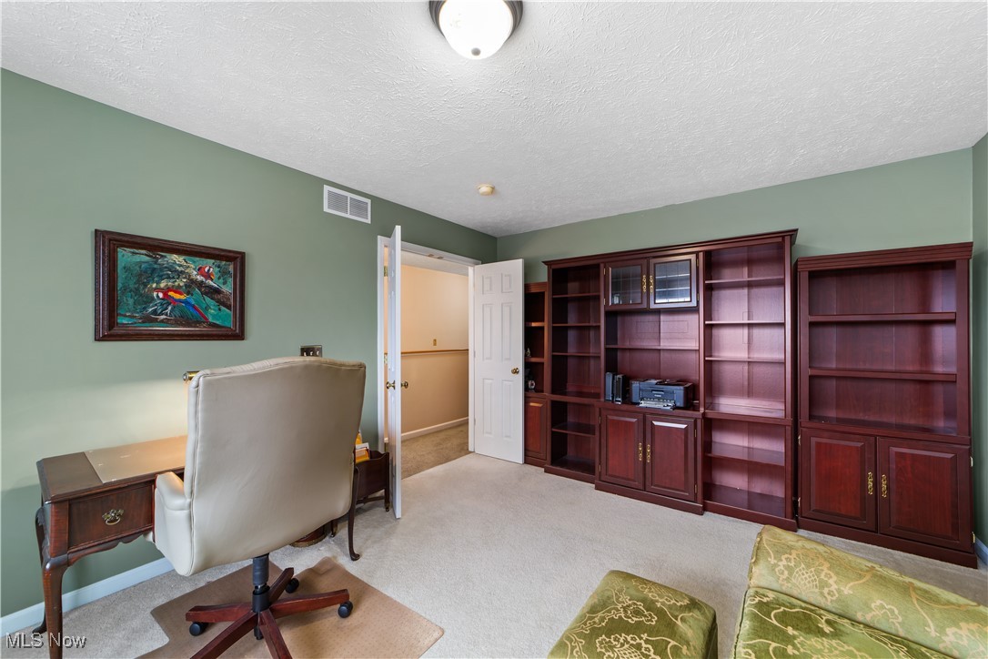 4461 Sexton Road Cleveland, OH 44105 - Photo 25 of 47 Carpeted bedroom featuring a textured ceiling