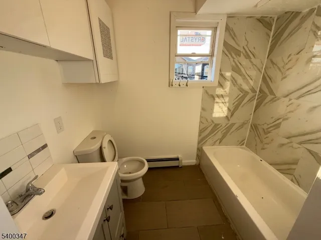 a bathroom with a sink and bathtub