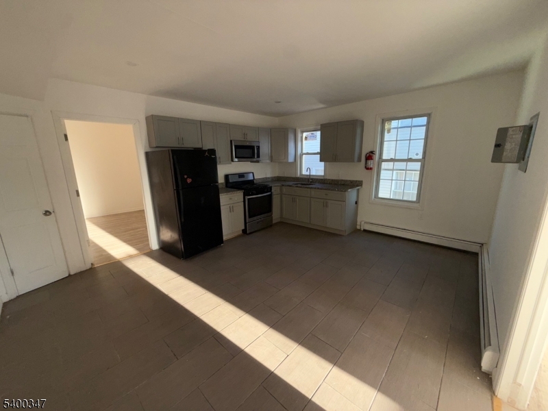 307 South Park Street Elizabeth Port, NJ 07206 - Photo 3 of 9 a view of a workspace with furniture and a window