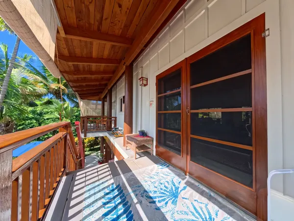 a view of deck with wooden floor and iron stairs
