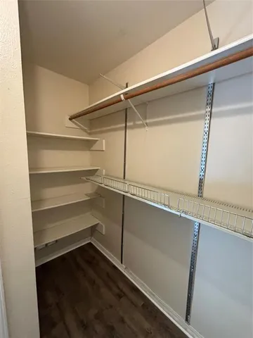 a storage room with wooden floor