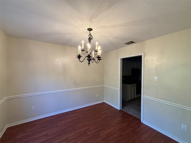 a view of a livingroom with wooden floor