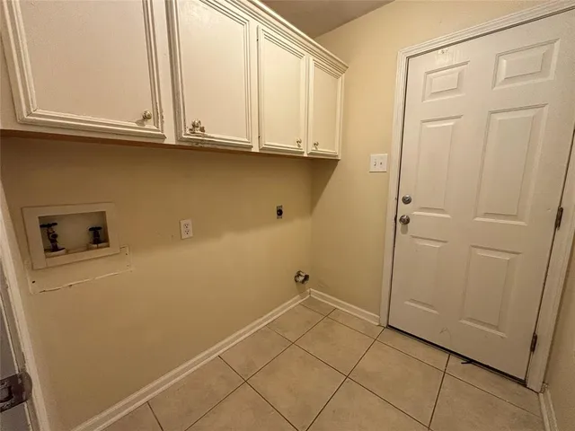 a view of storage and utility room with washer and dryer