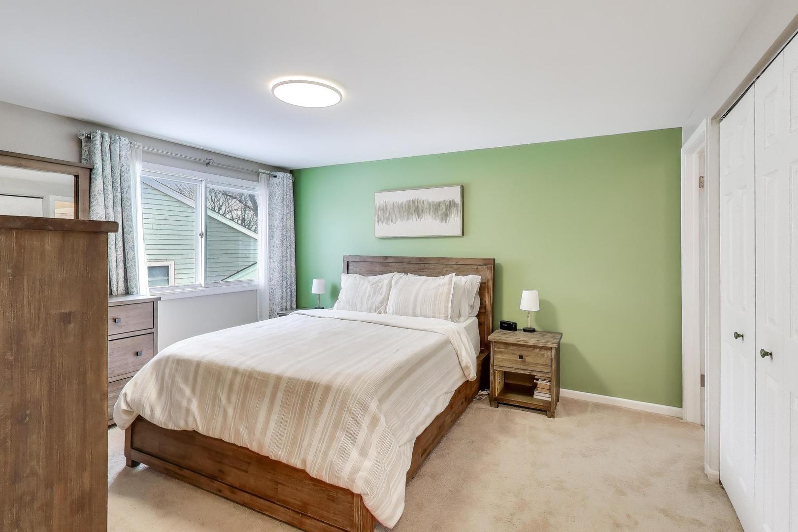 421 Berry Drive Naperville, IL 60540 - Photo 13 of 26 a bedroom with a bed and a window