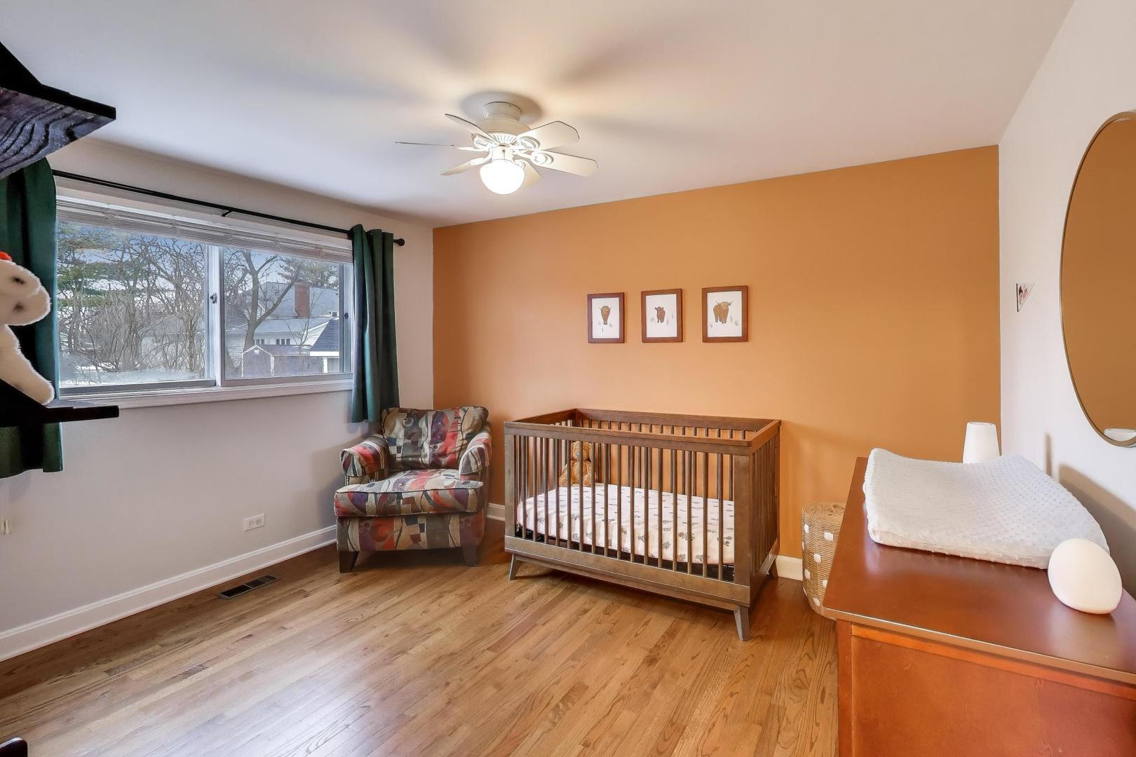 421 Berry Drive Naperville, IL 60540 - Photo 15 of 26 a bedroom with furniture and window