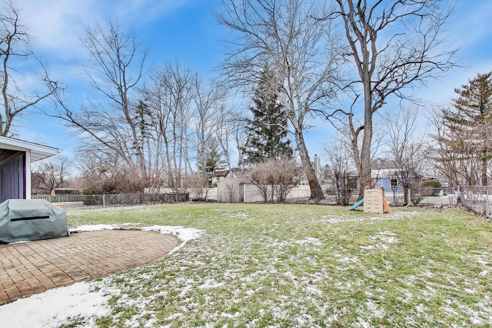 421 Berry Drive Naperville, IL 60540 - Photo 22 of 26 a view of a field of grass and trees