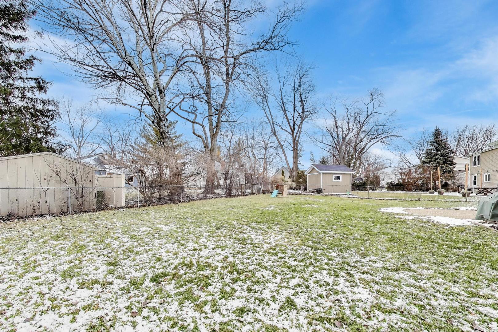 421 Berry Drive Naperville, IL 60540 - Photo 23 of 26 a view of a field of grass and trees