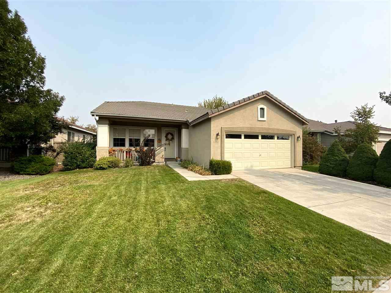 1641 Brentworth Way Reno, NV 89521 - Photo 11 of 11 a front view of a house with a yard