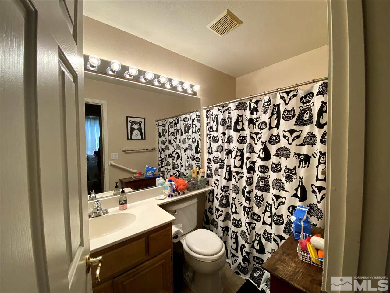 1641 Brentworth Way Reno, NV 89521 - Photo 2 of 11 a bathroom with a sink toilet and shower