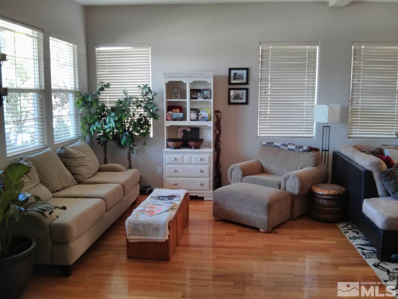 1641 Brentworth Way Reno, NV 89521 - Photo 3 of 11 a living room with furniture and a potted plant
