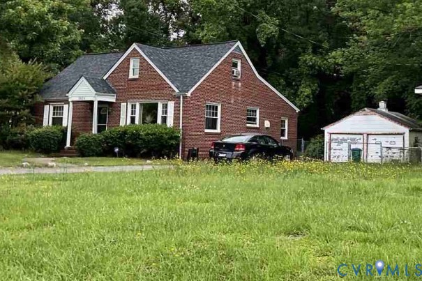 3929 Rebecca Road Richmond, VA 23234 - Photo 2 of 3 a front view of a house with garden