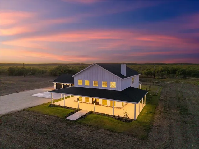 a view of a lake with a house in the background